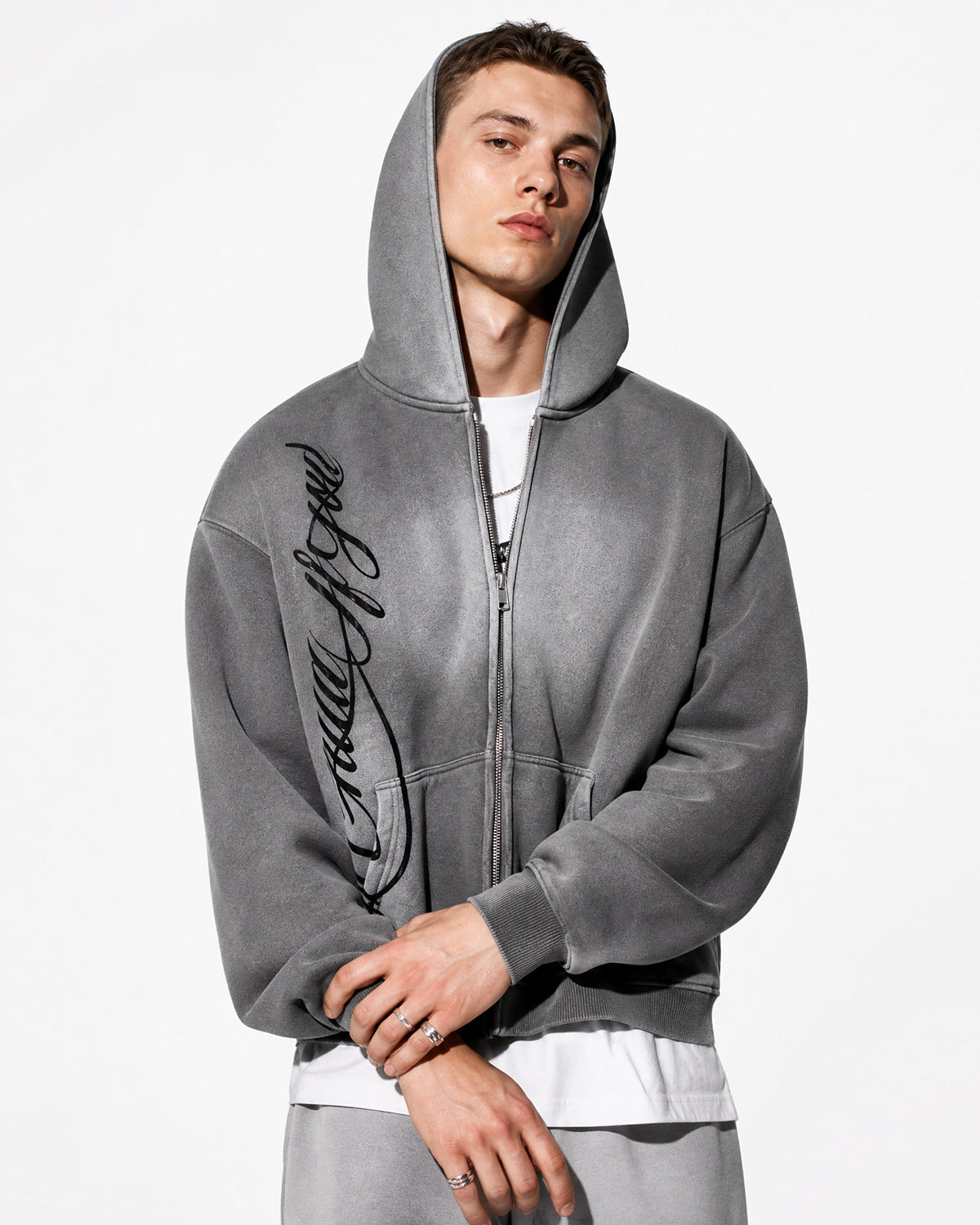 Men's grey acid-wash zip-up hoodie with hood, graphic print and front pockets