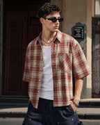 Unisex boxy plaid shirt with short sleeves and chest pocket