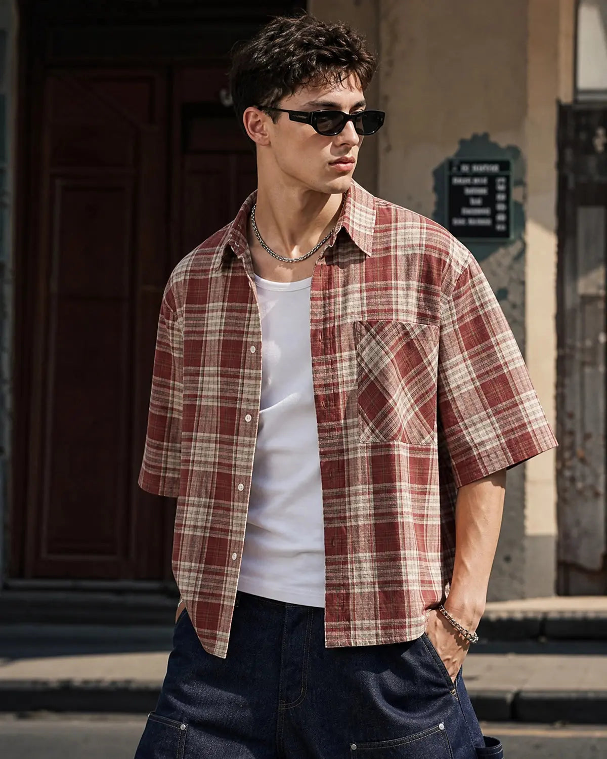 Unisex boxy plaid shirt with short sleeves and chest pocket
