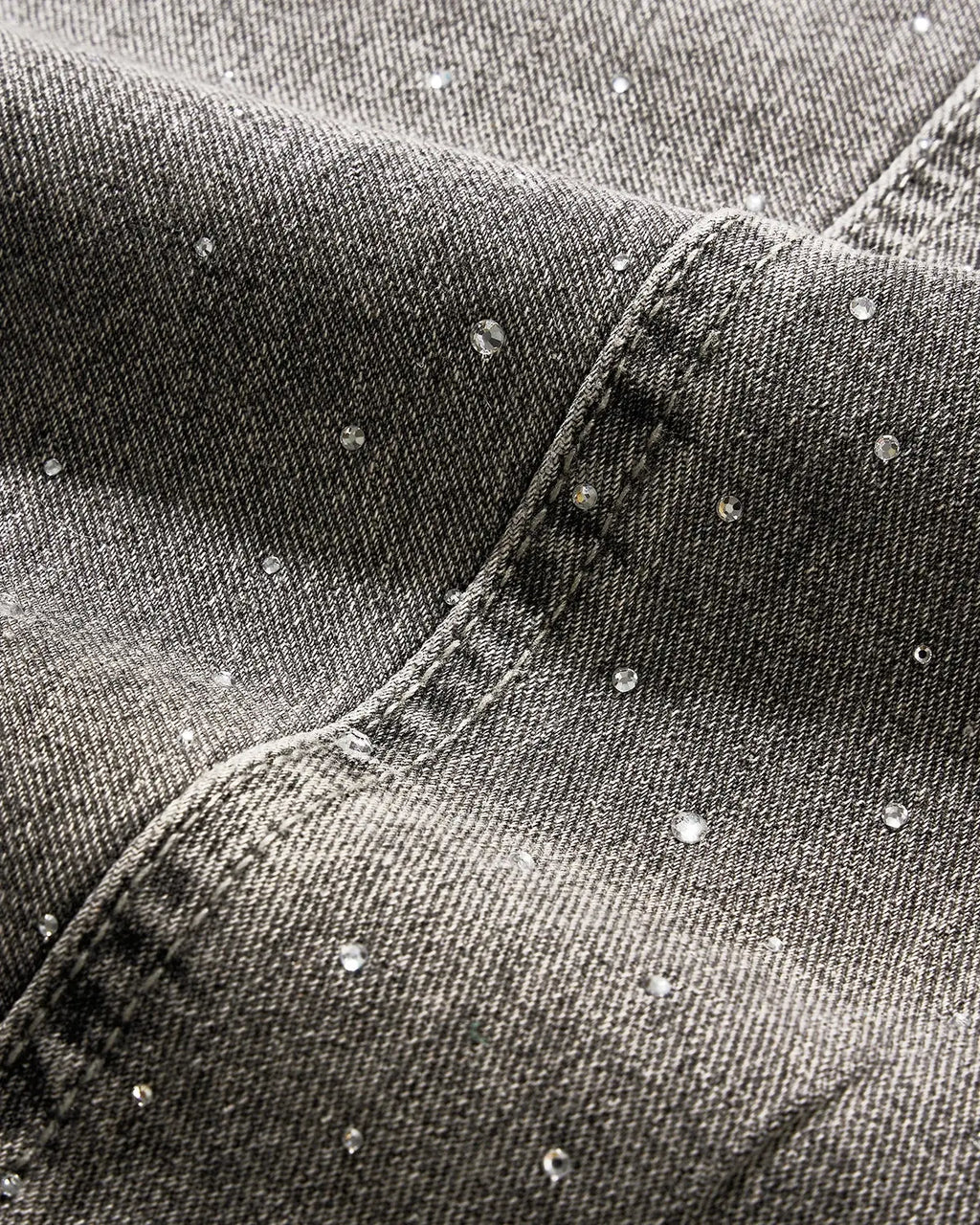 Light gray washed wide-leg jeans with rhinestone lower-leg detail