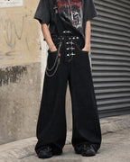 Black denim bib jeans with asymmetric shoulder strap, buckle details and wide legs