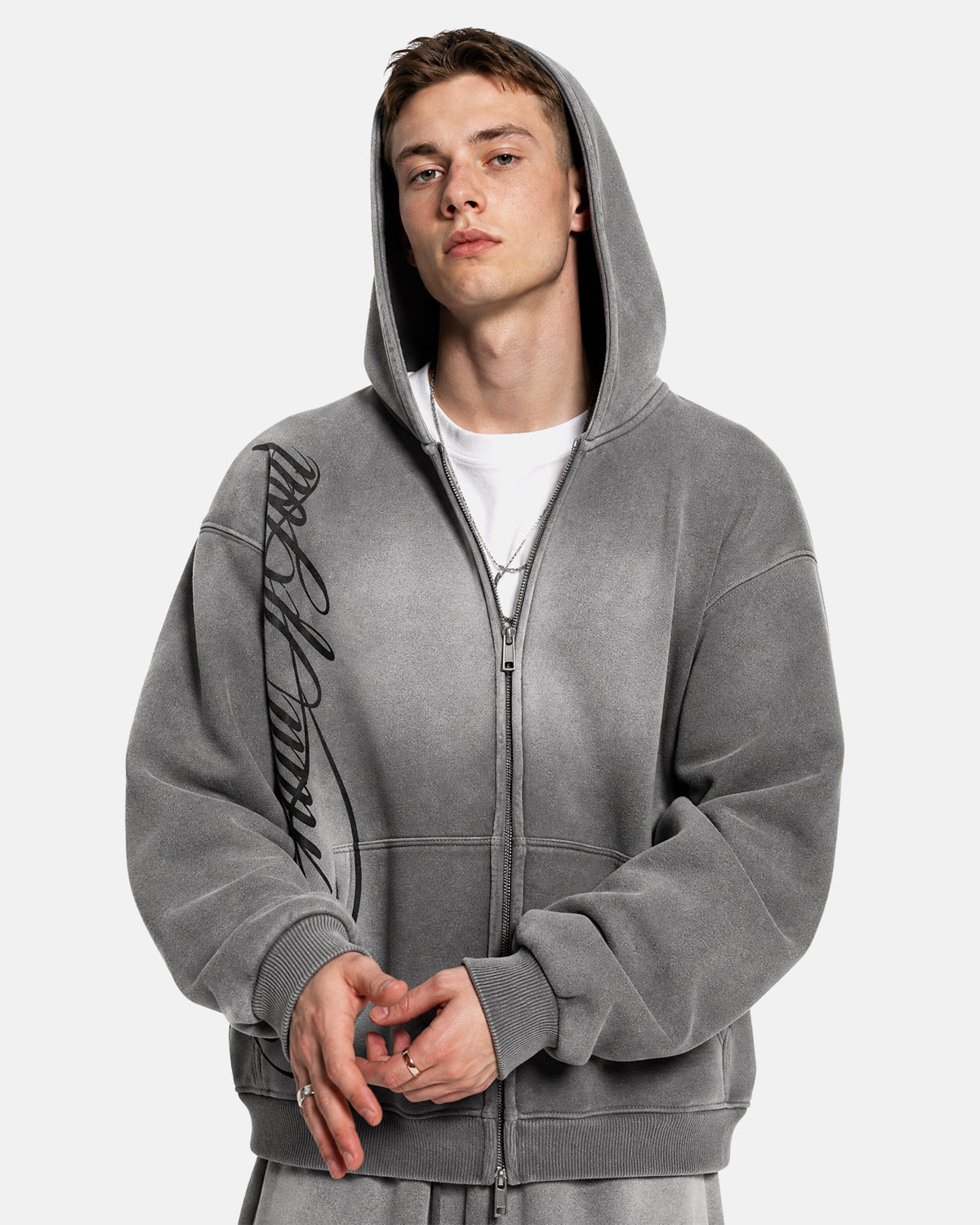 Men's grey acid-wash zip-up hoodie with hood, graphic print and front pockets