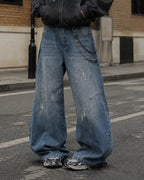 Distressed baggy jeans with wide legs and stitched panel details