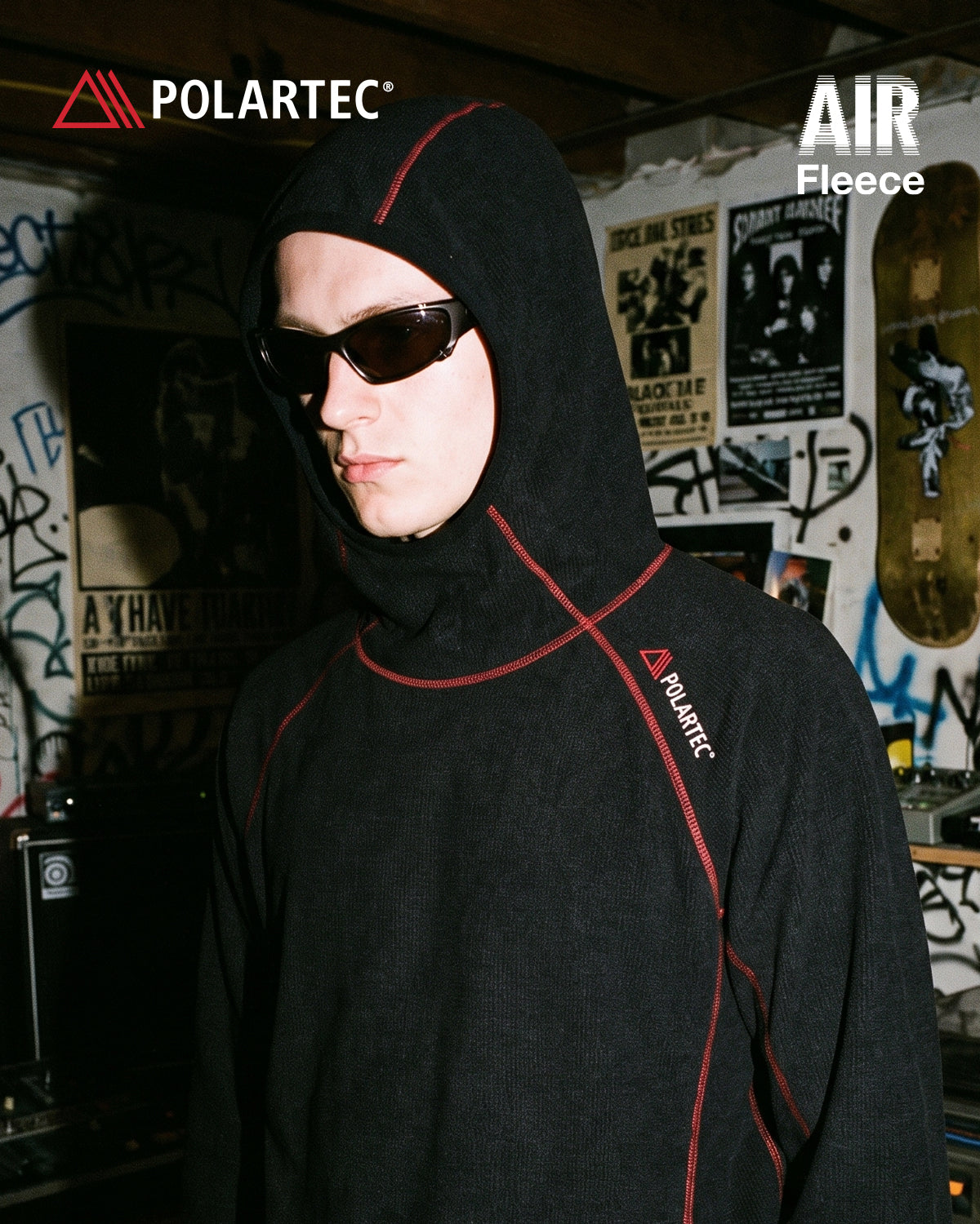 High-neck hooded pullover with long sleeves and contrast seam detailing