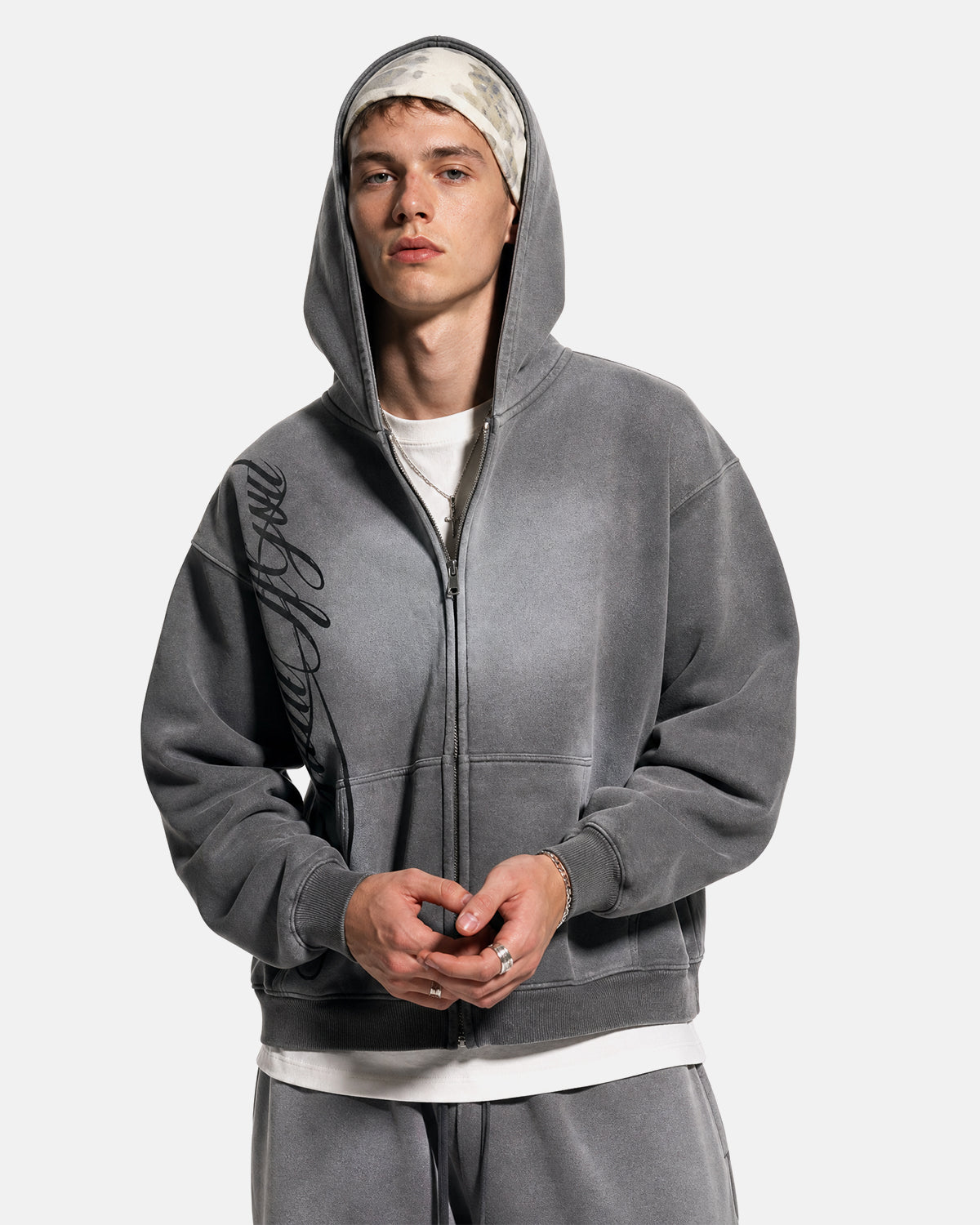 Men's grey acid-wash zip-up hoodie with hood, graphic print and front pockets