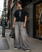 Light gray washed wide-leg jeans with rhinestone lower-leg detail