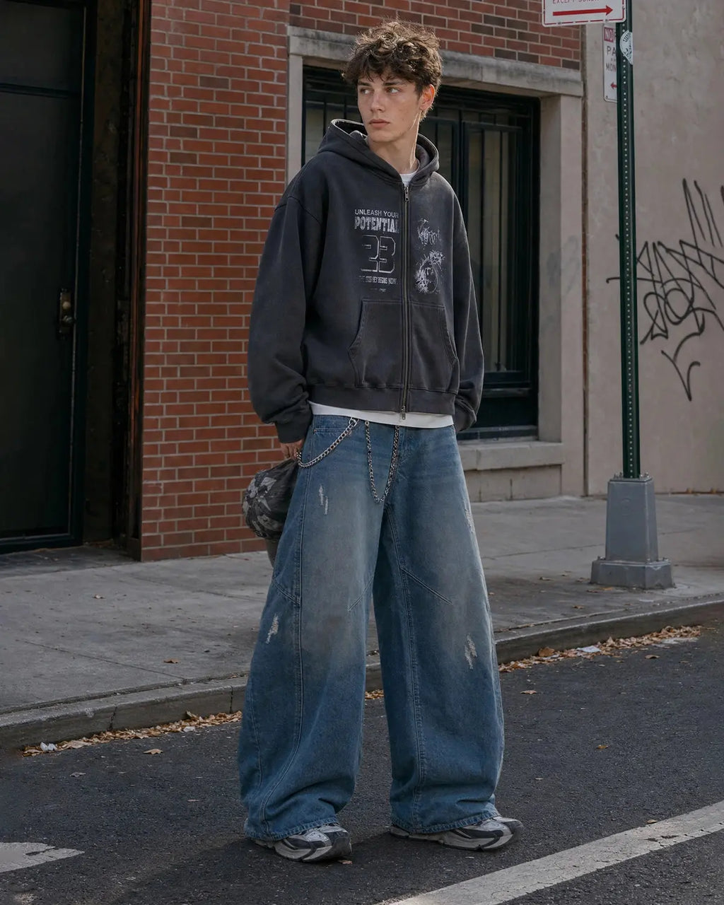 Distressed baggy jeans with wide legs and stitched panel details