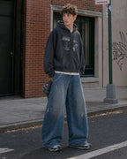 Distressed baggy jeans with wide legs and stitched panel details