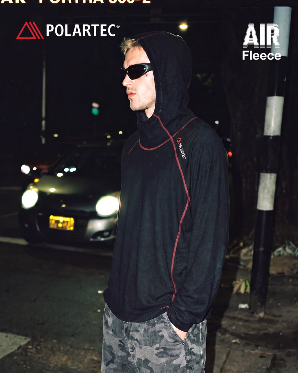 High-neck hooded pullover with long sleeves and contrast seam detailing