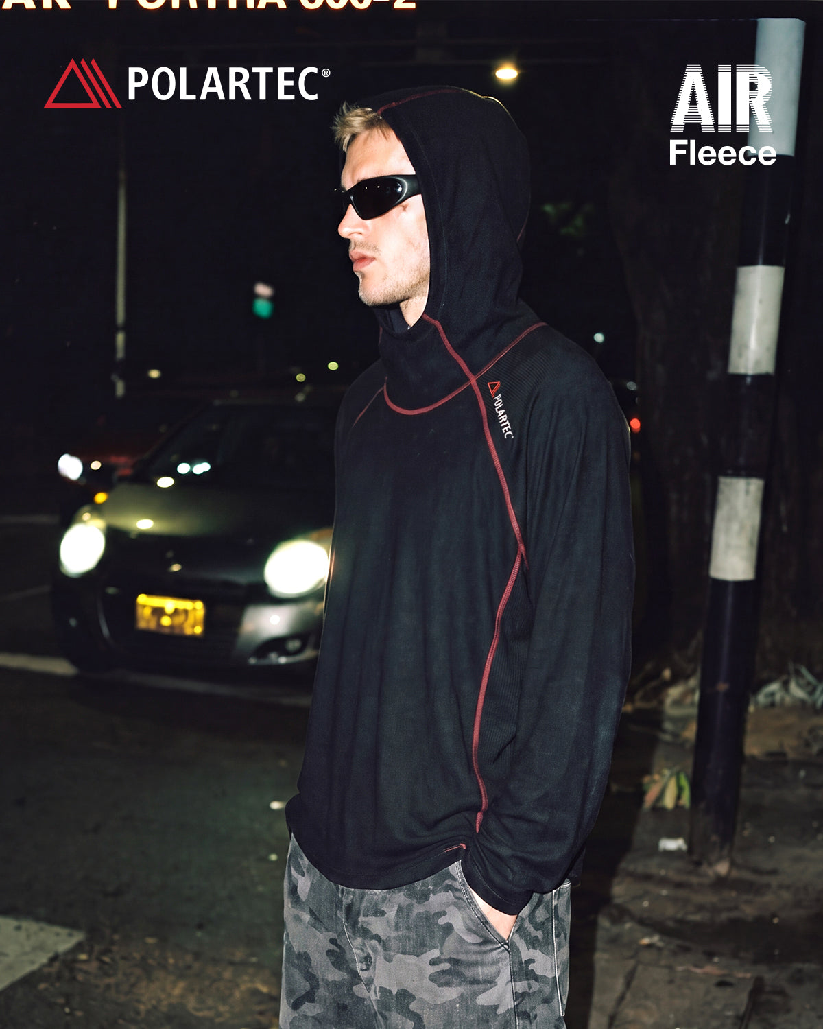 High-neck hooded pullover with long sleeves and contrast seam detailing
