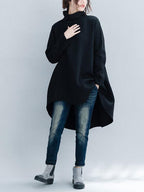 Women's loose turtleneck sweatshirt with long sleeves and a hi-low hem