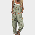 Women's green floral print jumpsuit with wide legs, sleeveless design and front pockets