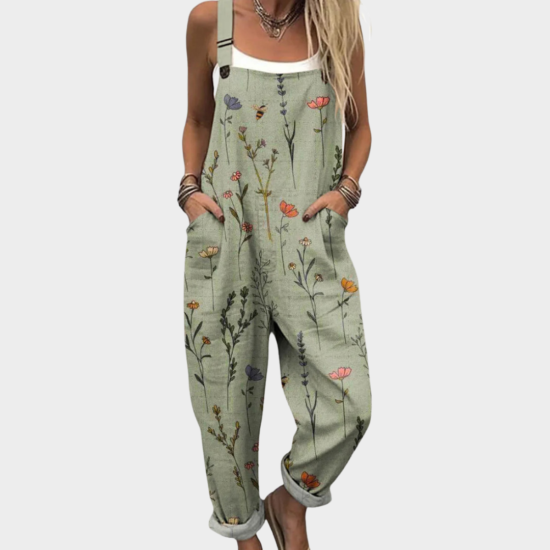 Women's green floral print jumpsuit with wide legs, sleeveless design and front pockets