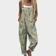 Women's green floral print jumpsuit with wide legs, sleeveless design and front pockets