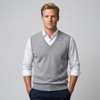 Men's sleeveless V-neck jumper layered over a collared shirt