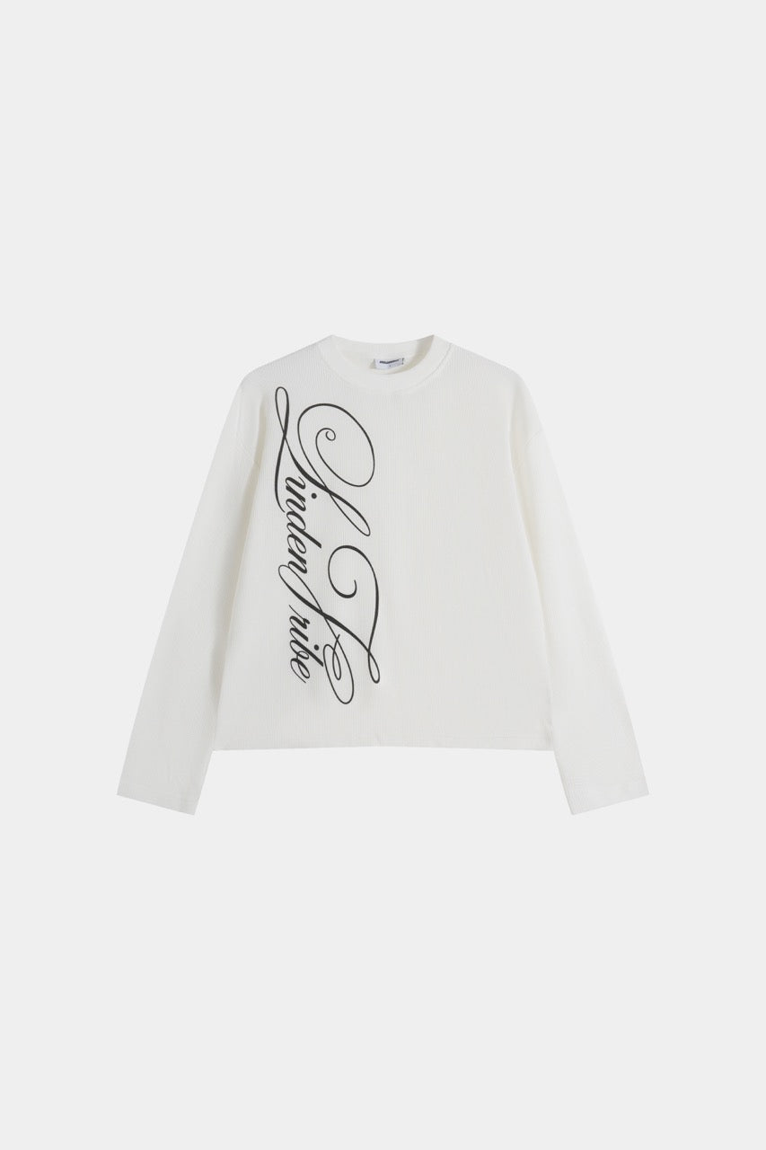White waffle sweatshirt with black script graphic and long sleeves