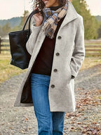 Women's textured mid-length coat with lapel collar and button front