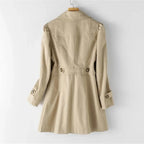 Women's belted trench coat with wide lapels and flap pockets
