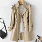 Women's belted trench coat with wide lapels and flap pockets
