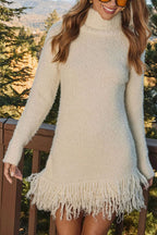 Women's cream turtleneck knit mini dress with long sleeves and tassel hem