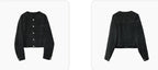 Women's cropped dark denim jacket with long sleeves and front pockets