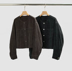 Women's cropped dark denim jacket with long sleeves and front pockets