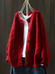 Women's cable-knit cardigan with crew neckline, long sleeves and button front