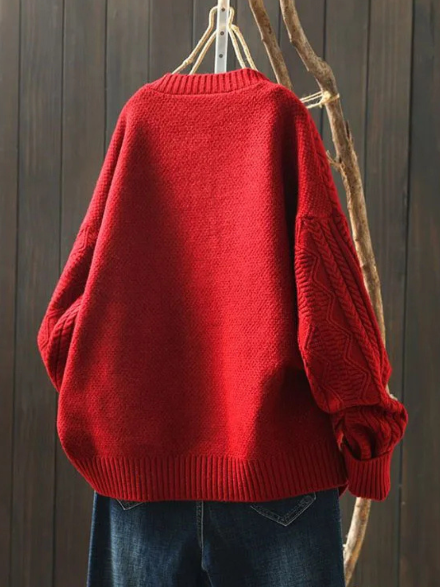 Women's cable-knit cardigan with crew neckline, long sleeves and button front