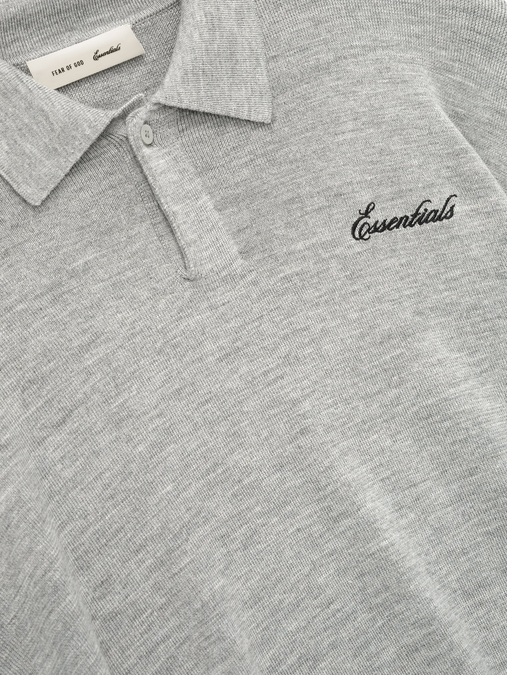 Gray long sleeve knit polo with collar and chest script detail