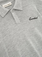 Gray long sleeve knit polo with collar and chest script detail