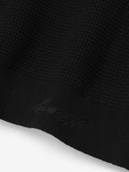 Black men's waffle knit crewneck sweater with long sleeves