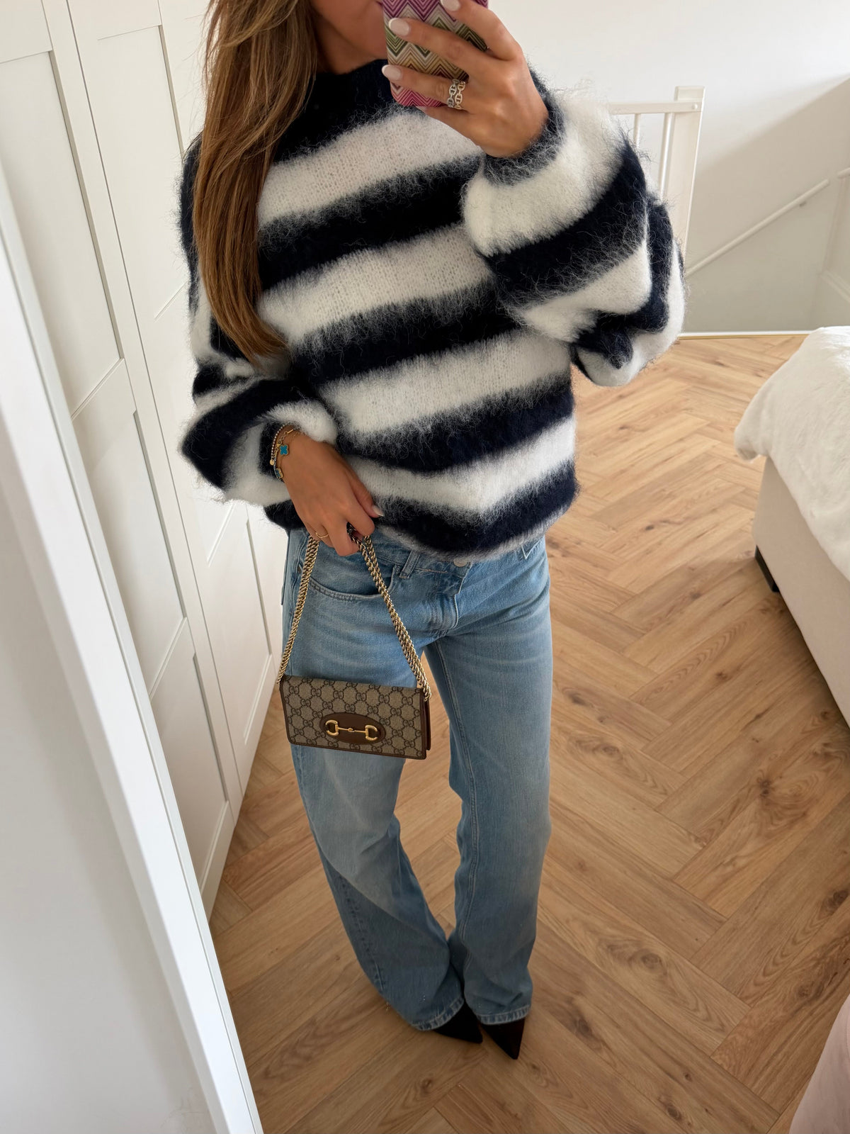 Women's navy and cream striped mock neck jumper with long sleeves