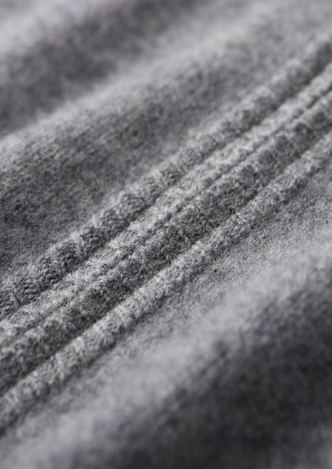 Men's two-tone grey knit tracksuit set with a zip jacket and drawstring trousers