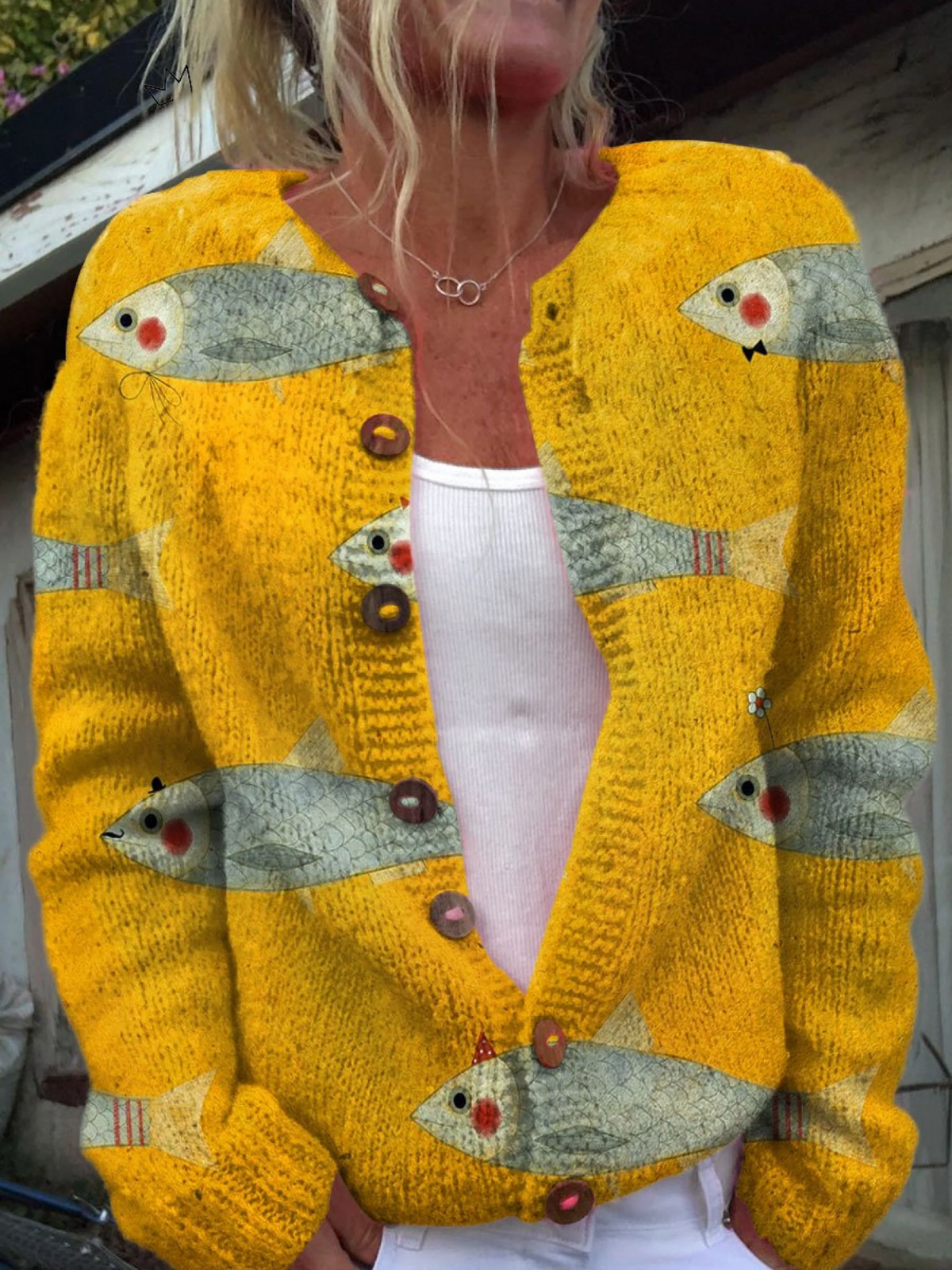 Women's yellow cardigan with repeated illustrated fish motifs, V-neckline, buttons and long sleeves