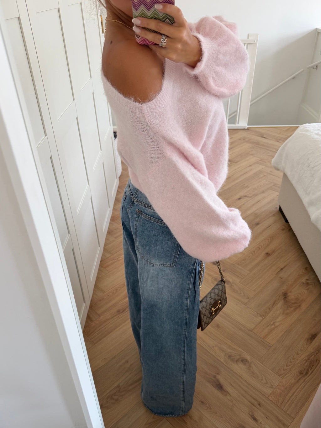 Pink fuzzy off-shoulder jumper with long balloon sleeves and ribbed trims