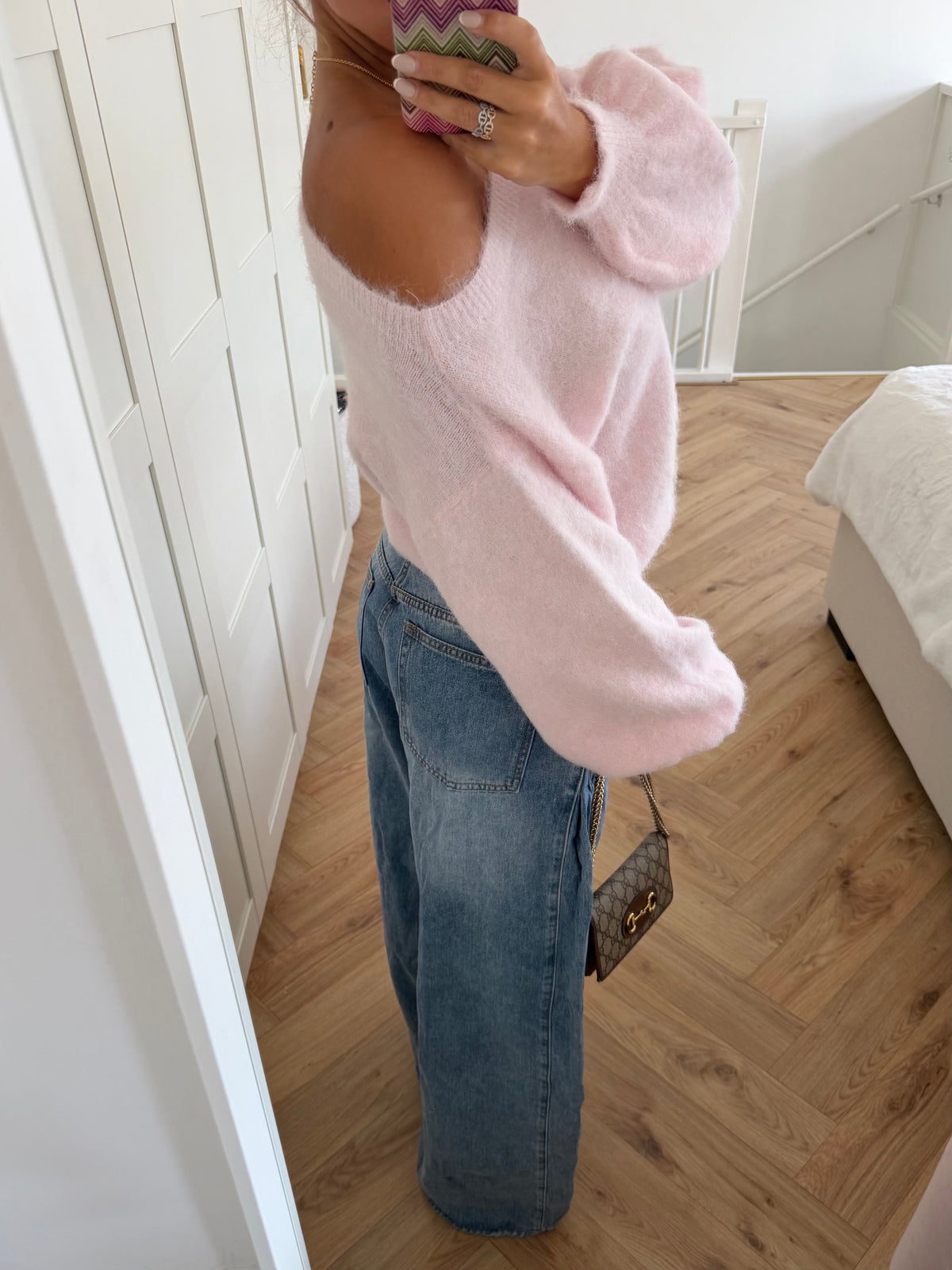 Pink fuzzy off-shoulder jumper with long balloon sleeves and ribbed trims