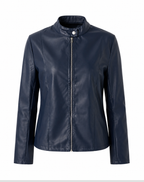 Woman wearing a fitted leather jacket with stand collar and zipper