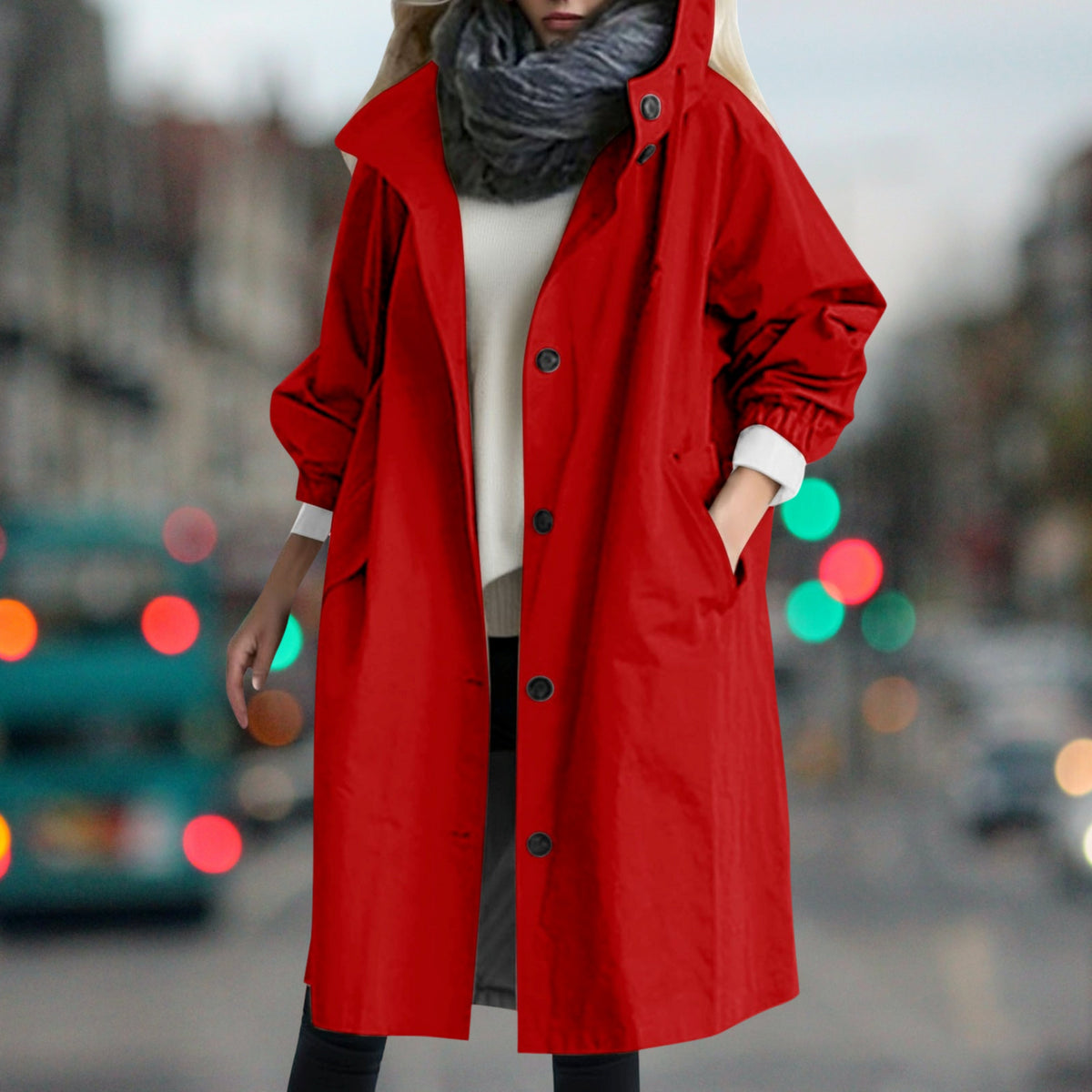 Women's longline hooded rain coat with button front and side pockets
