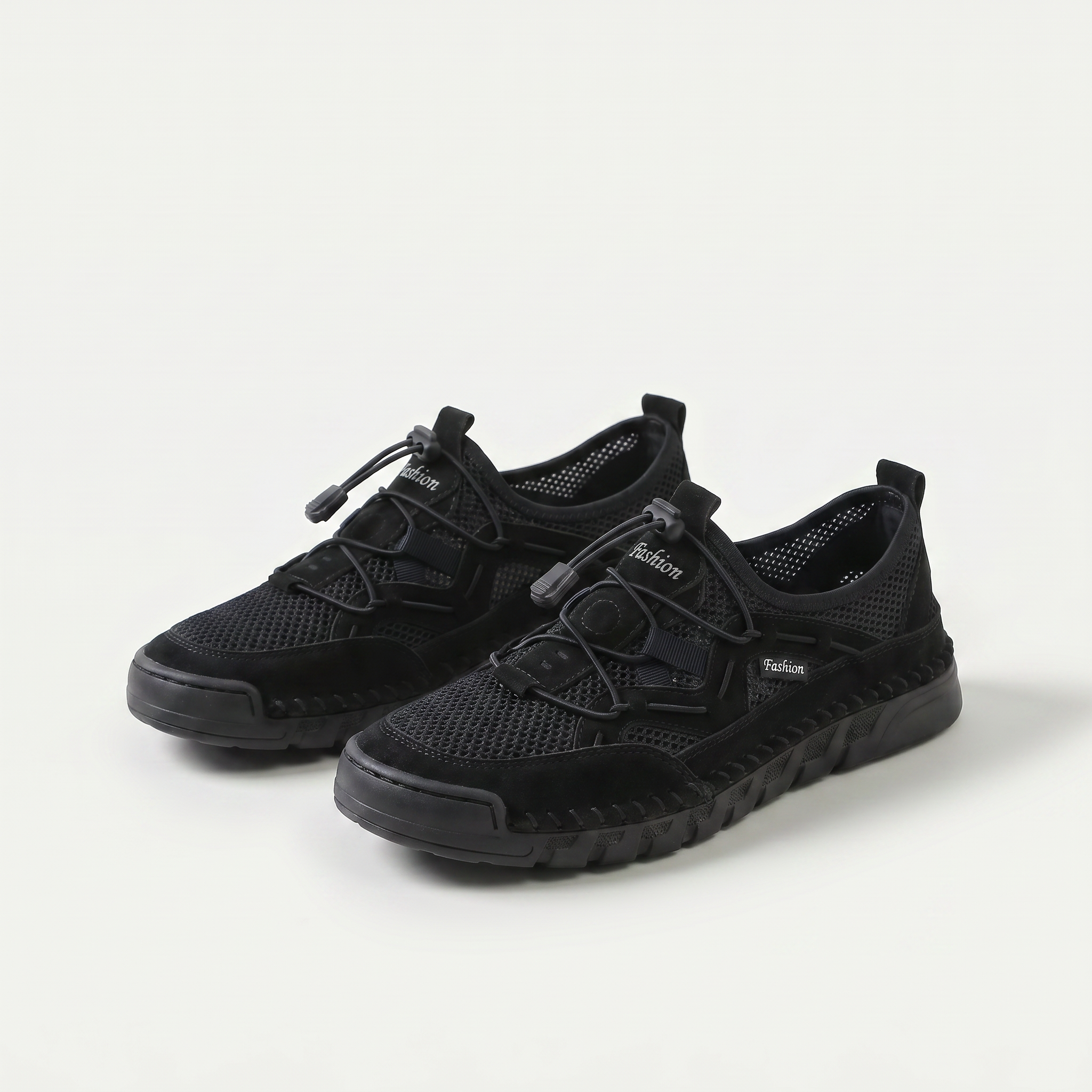 Mesh sneakers with toggle laces and segmented flat soles