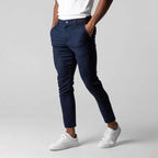 Men's slim tapered chinos trousers shown in black and navy with side pockets