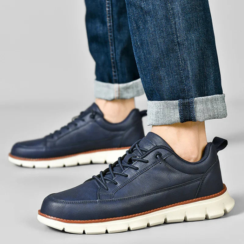 Low top lace-up sneaker with stitched panels and chunky textured sole