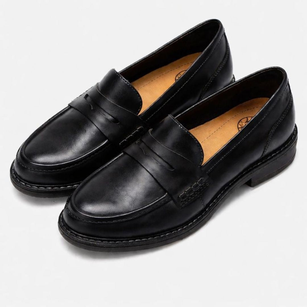 Men's penny loafers with rounded toes, stitched trim and low heels