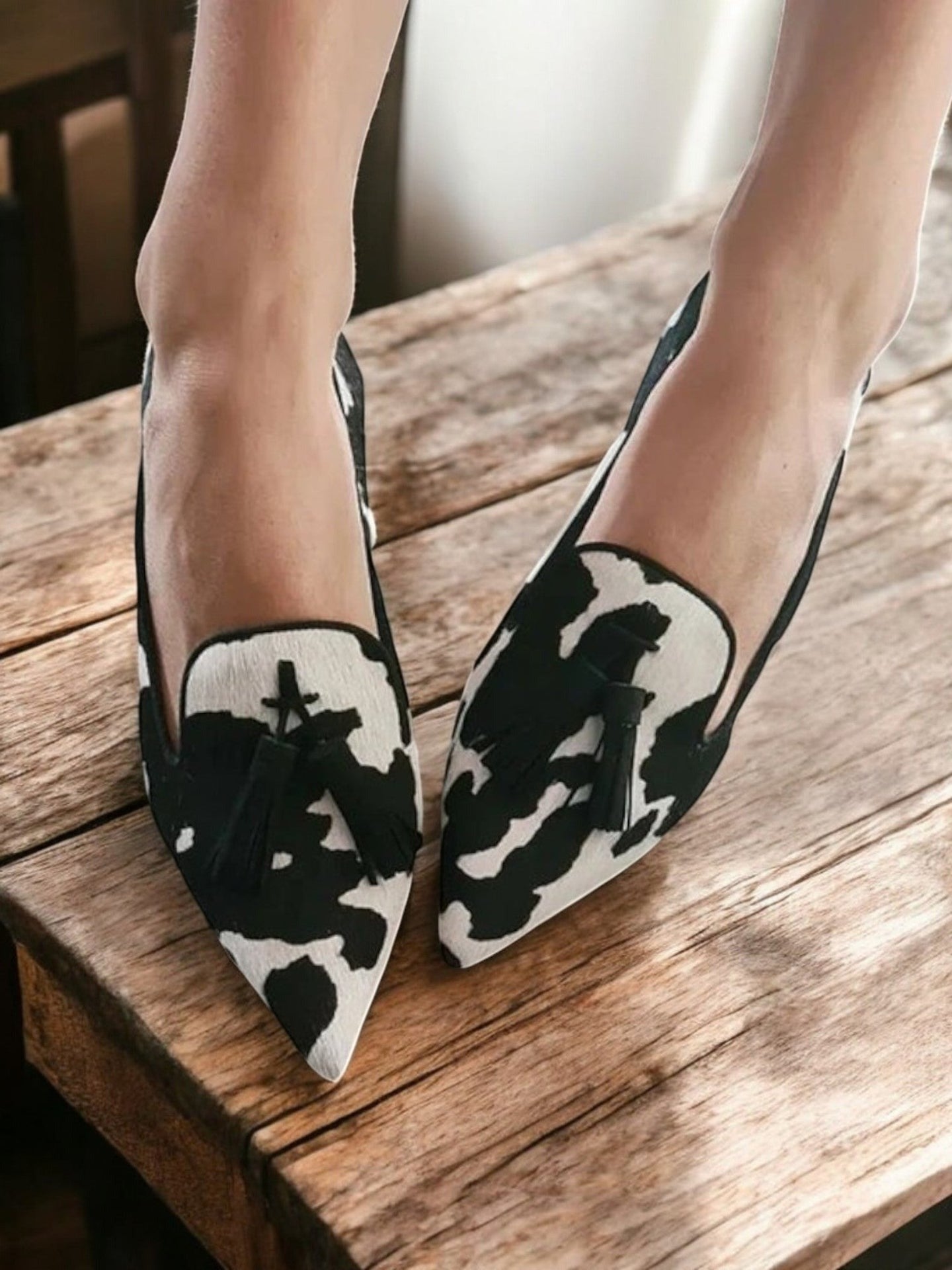 Women's pointed animal print loafers with coloured tassels
