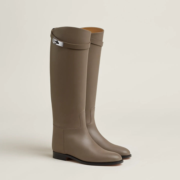 Women's tall riding boots with low heels, round toes and strap detailing