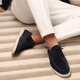 Men's lace-up moccasin shoes shown in black and beige with round toes and flat soles