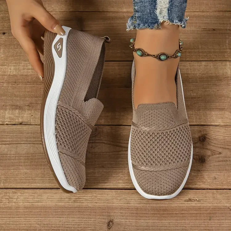 Women's knit slip-on sneakers with textured panels and white soles