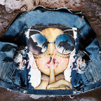 Women's printed denim jacket with portrait graphic and distressed details