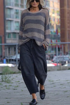 Women's striped open-knit sweater with crew neckline and long sleeves