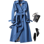 Women's long belted trench coat with double-breasted buttons, lapels and cuff straps