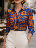 Women's blue floral button blouse with pointed collar and long sleeves